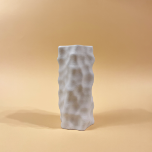 White 3D-printed sculptural vase with an organic, dimpled surface