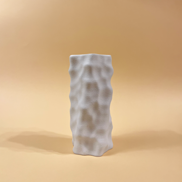 White 3D-printed sculptural vase with an organic, dimpled surface