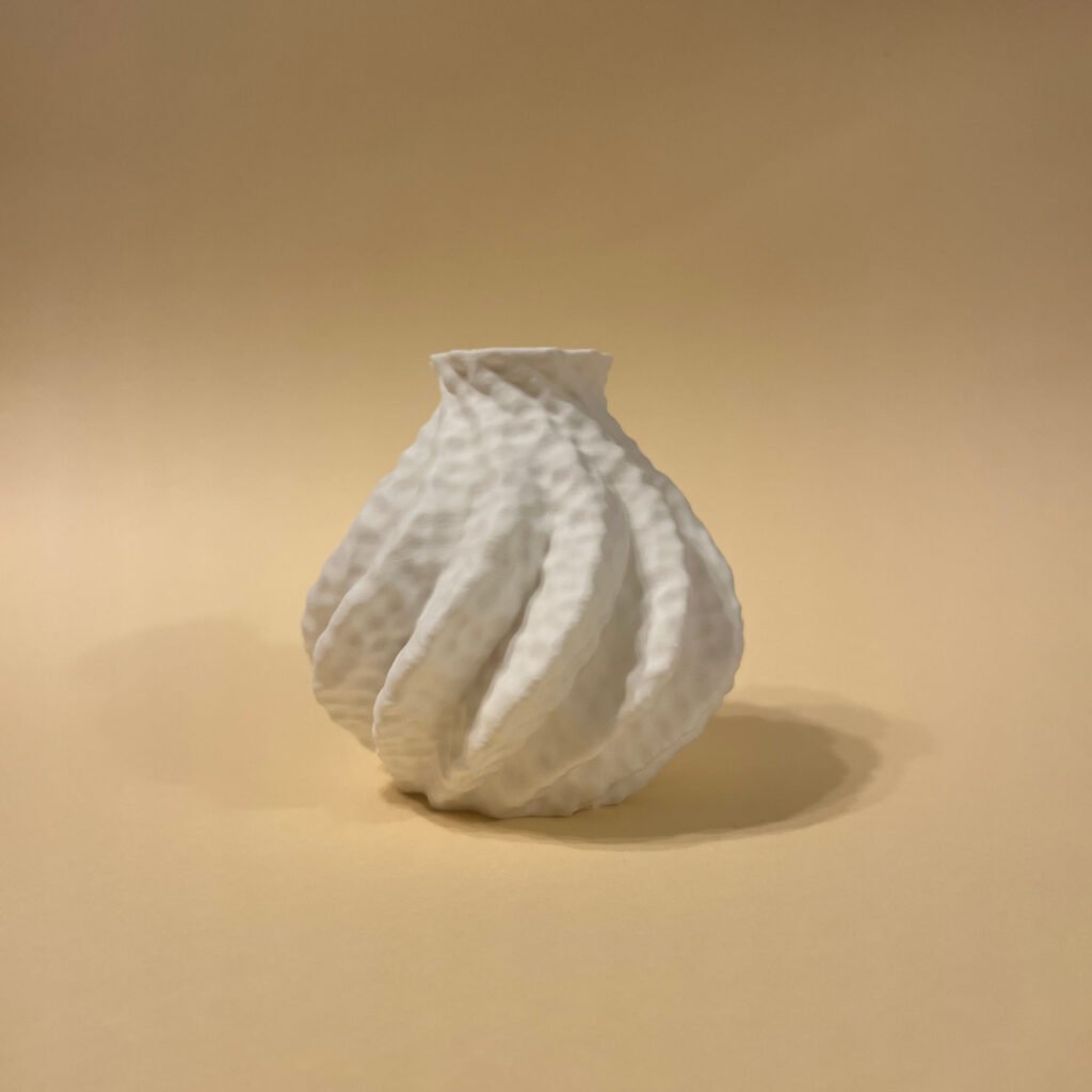3D printed Astraeus vase in soft peachy background – sustainable sculptural home accent